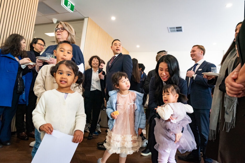 Families enjoying the Scott Kim Real Estate office event